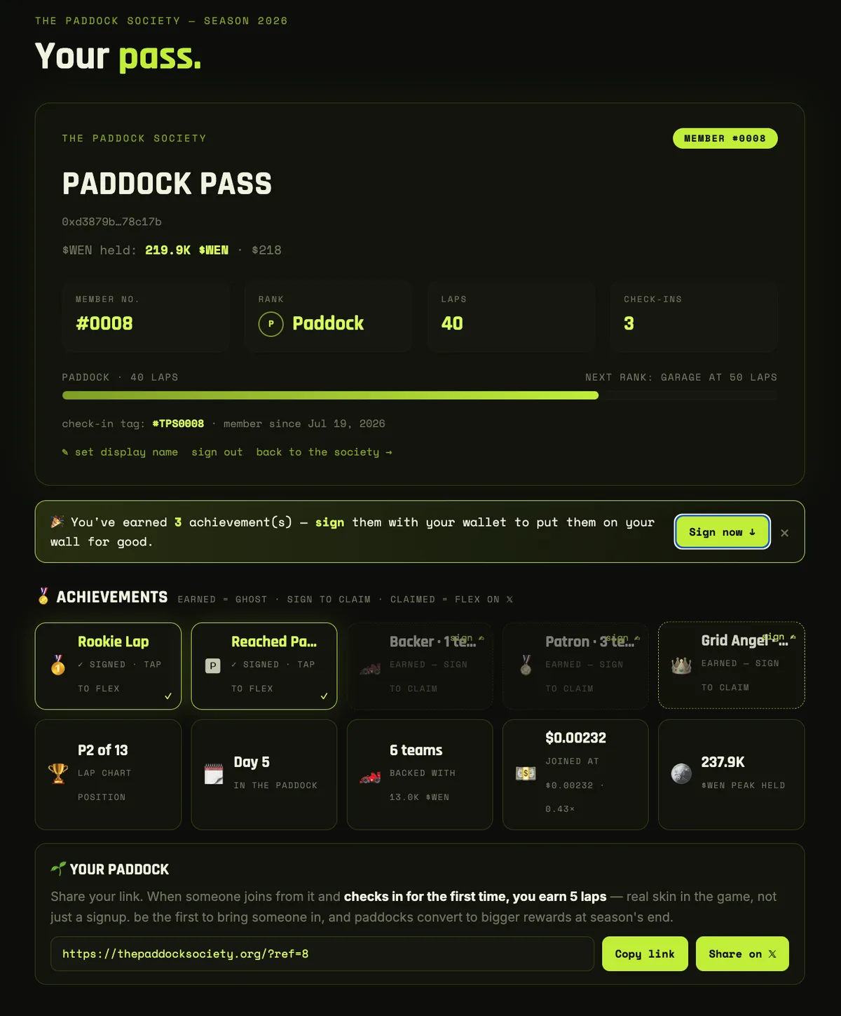 A real Paddock Pass — member number, rank, laps, check-ins, achievements
